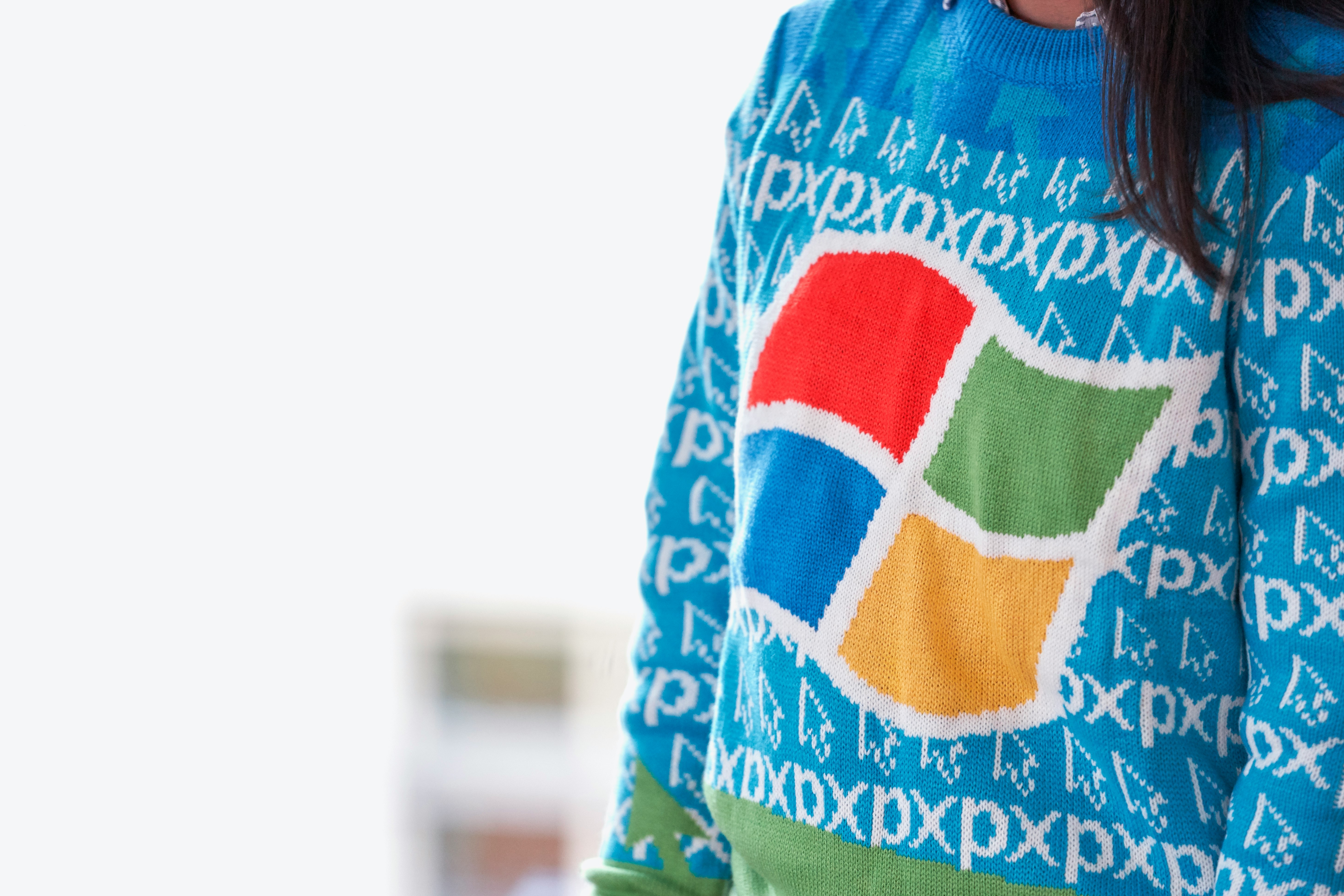 woman wearing blue Windows XP sweater